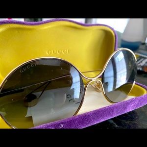Blue tinted Gucci sunglasses with case.